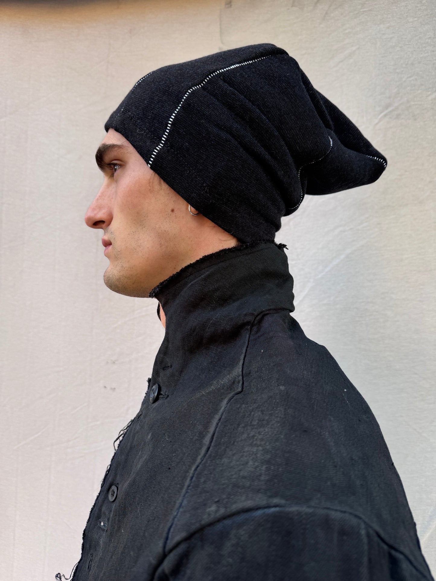 FW25 || TRIANGULAR PANEL BEANIE || OVERLOCKED || WHITE ON BLACK